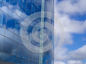 Cloudy sky reflection on the skyscraper windows
