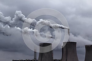 cloudy sky with smoking power coal station