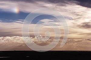 Cloudy sky with sundog