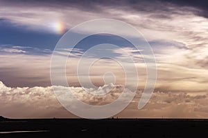 Cloudy sky with sundog