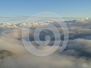 Cloudy sky at sunset over mountain top