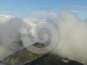 Cloudy sky at sunset over mountain top