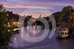 Cloudy sky at sunset, Regnitz river with ships in Bamberg