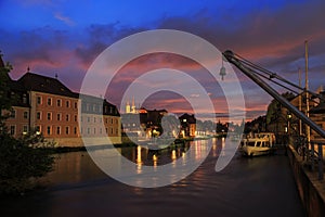 Cloudy sky at sunset, Regnitz river with ships in Bamberg