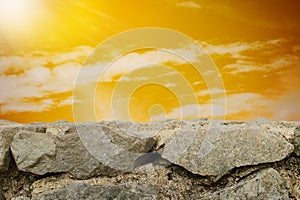 Cloudy sky sunset and Stone wall background