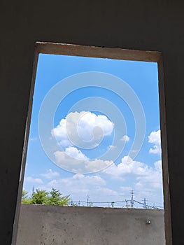 Cloudy sky view from window and door with black background