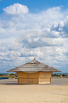 Cloudy sky with wooden cabin