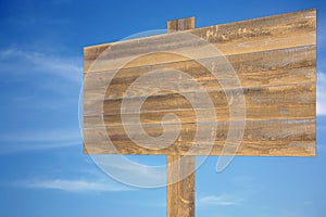 Cloudy sky with wooden sign