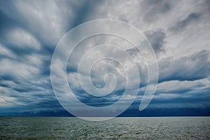 Cloudy storm in the sea before rainy. Tornado storms cloud above the sea.