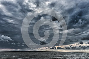 Cloudy and Stormy Clouds Above the Baltic Sea in Latvia. Baltic Sea. Evening Photo Shoot. Wide Angle