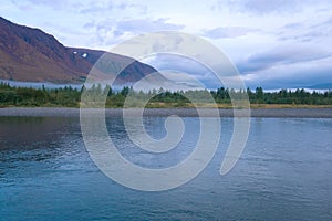 Cloudy summer morning on the Sob river Polar Ural, Russia