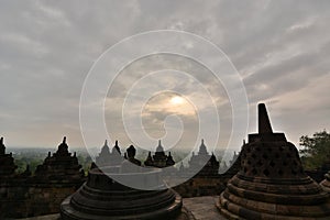 Cloudy sunrise in Borobudur temple. Magelang. Central Java. Indonesia