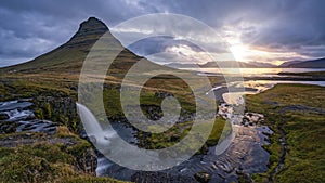 Cloudy sunrise at the iconic Kirkjufellsfoss waterfall in the The Snaefellsnes Peninsula, West Iceland