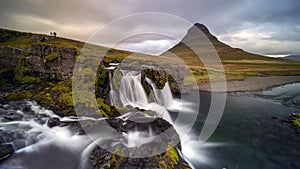 Cloudy sunrise at the iconic Kirkjufellsfoss waterfall in the The Snaefellsnes Peninsula, West Iceland