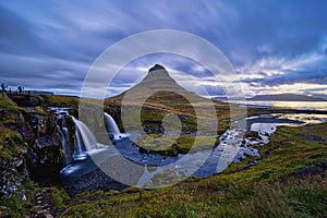 Cloudy sunrise at the iconic Kirkjufellsfoss waterfall in the The Snaefellsnes Peninsula, West Iceland