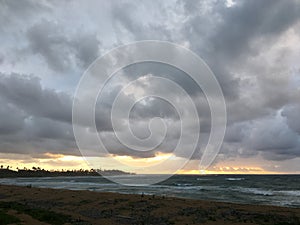 Cloudy Sunrise in July at Hikinaakala Heiau in Wailua on Kauai Island, Hawaii.