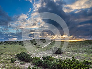 Cloudy sunrise over the dunes