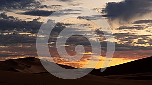 Cloudy sunset in the lut desert