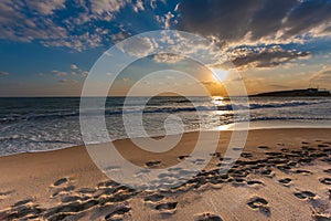 Cloudy sunset over a deserted beach