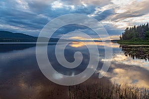 A cloudy sunset over McLeod Lake at Whiskers Point Provincial Park, British Columbia, Canada