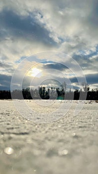 Cloudy sunset over the snowy field