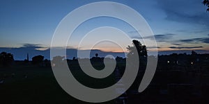 Cloudy sunset view in village