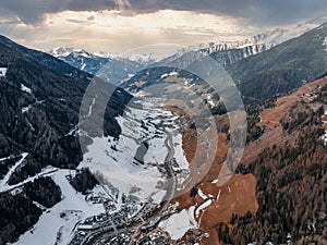 Cloudy valley if the Alpine village and the ski resort in Tyrol, Italy.