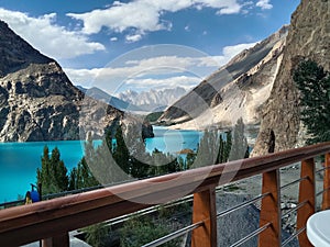 A cloudy valley with mountains and lake