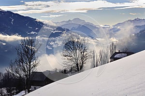 Cloudy valley in winter at evening