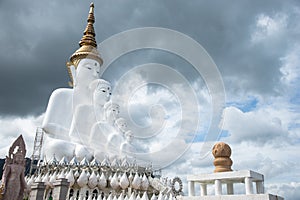 The cloudy and white five buddhas statue at Phra Thad Pha Son Kaew Temple. Khao-kho, Phetchaboon Distict, Thailand