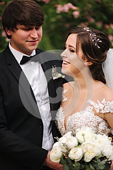 Clouse-up portrait of happy wedding couple. Broom and bride