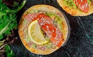Clouse up sandwich with smoked salmon, avocado, tomato