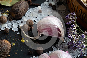 Clove of fresh garlic around Spices and sea salt  at black background. seasonings, Colorful natural meal additives. healthy food