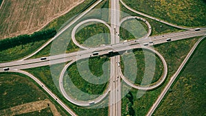 Clover or daisy type of road junction. Aerial view of highway road junction