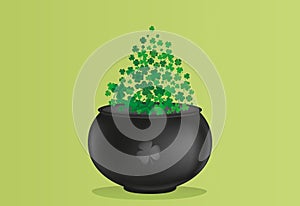 Clover inside the pot. A trefoil leaf flying comes out of the kettle