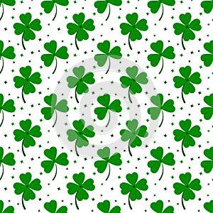 Clover leaves seamless pattern isolated on white background: green lucky four leaf clover and shamrock clover.