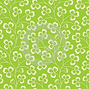 Clover leaves seamless vector pattern. St. Patrick`s Day green background. Shamrock wallpaper