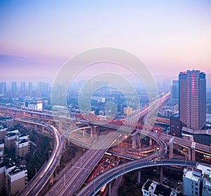 Cloverleaf interchange at dusk photo