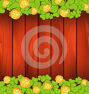 Clovers and golden coins on brown wooden background