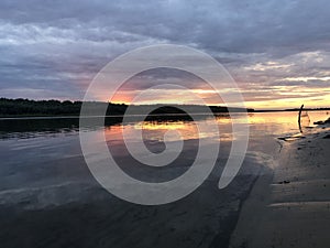 Clowdy sunset on a coutryside river