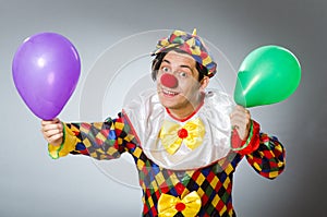 Clown with balloons in funny concept