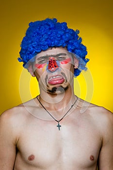Clown in a blue wig