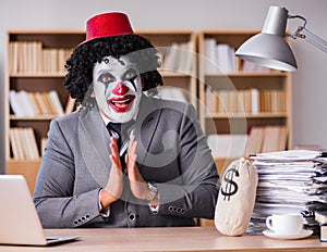 Clown businessman working in the office