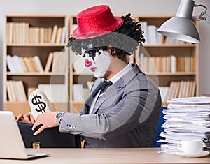 Clown businessman working in the office