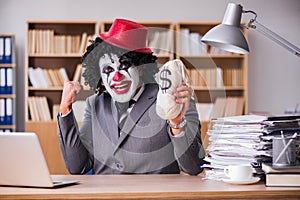 The clown businessman working in the office