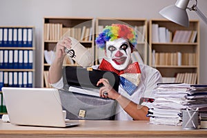 The clown businessman working in the office