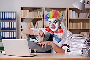 The clown businessman working in the office