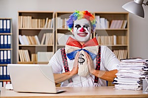 The clown businessman working in the office