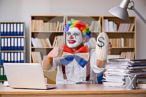 The clown businessman working in the office