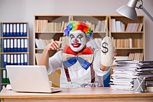 The clown businessman working in the office